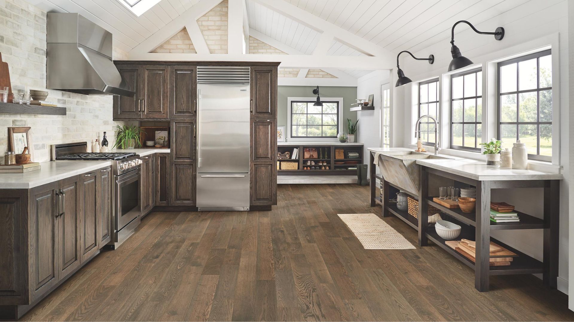 rustic dark stained hardwood flooring in an open kitchen