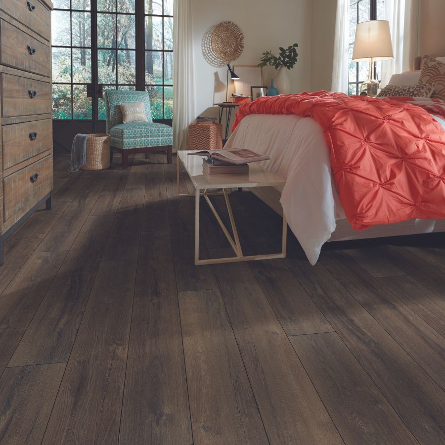 dark luxury vinyl floors in a cozy bedroom